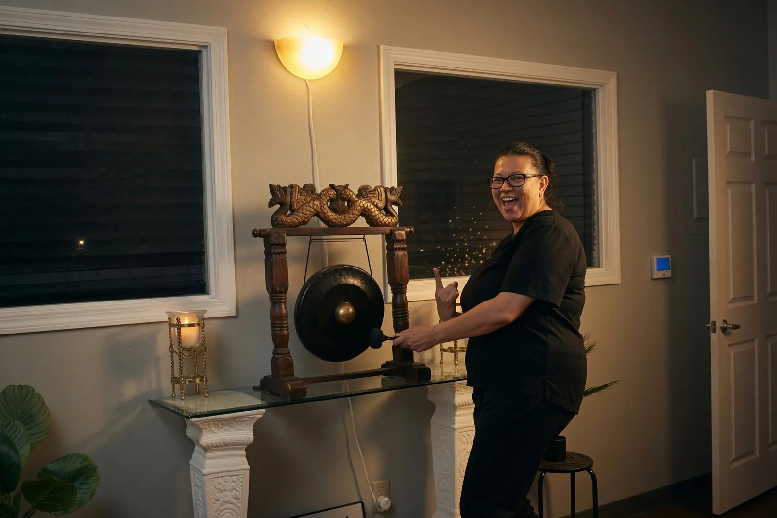 Excited student ringing the graduation gong — Texas Massage Academy, Brownwood TX