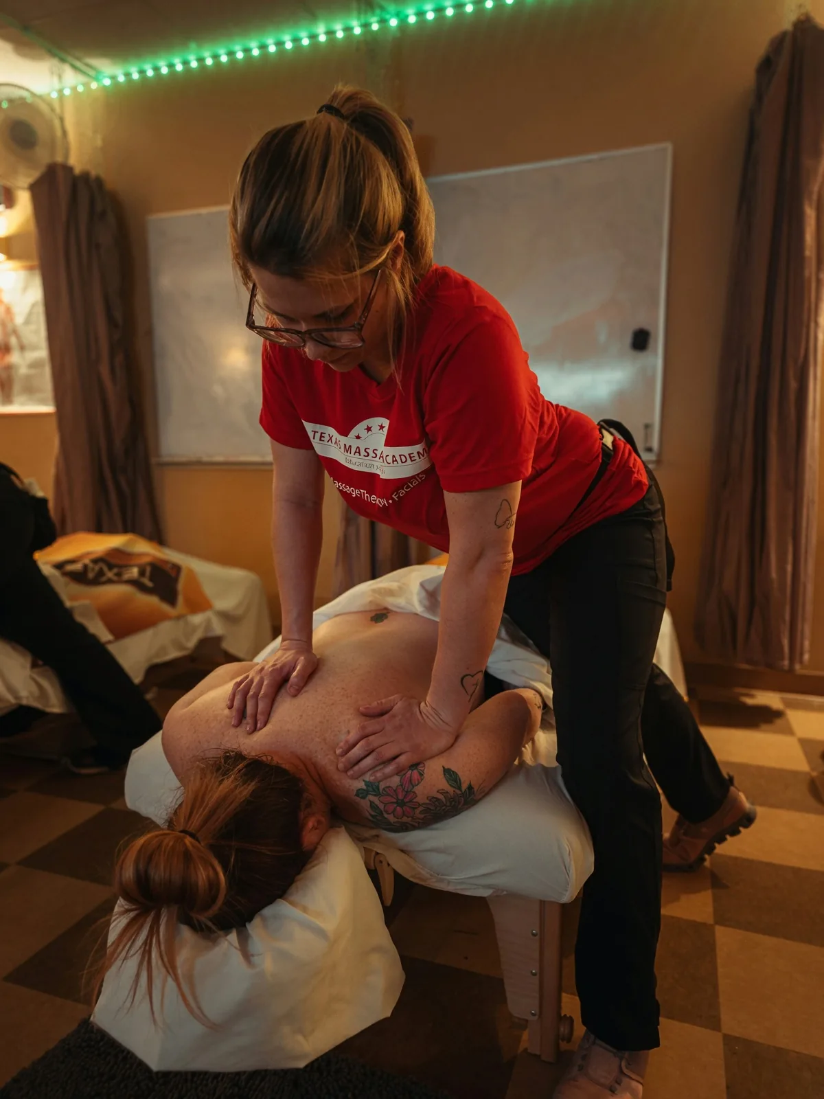 Female student practicing deep tissue massage — Texas Massage Academy, Brownwood TX