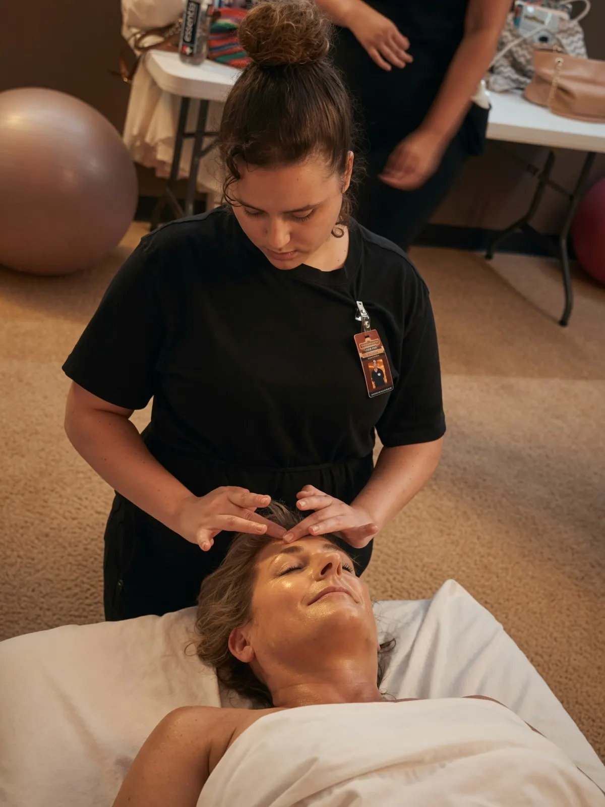 Female student giving forehead massage to client — Texas Massage Academy, Brownwood TX