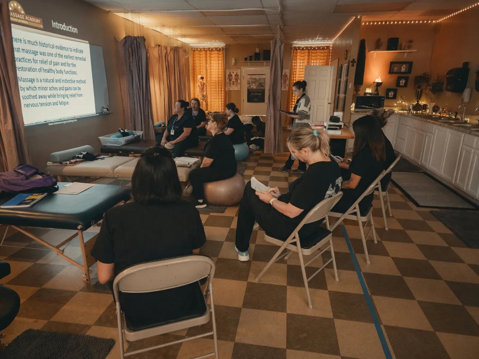 Massage therapy students in an evening lecture at the Texas Massage Academy classroom in Brownwood