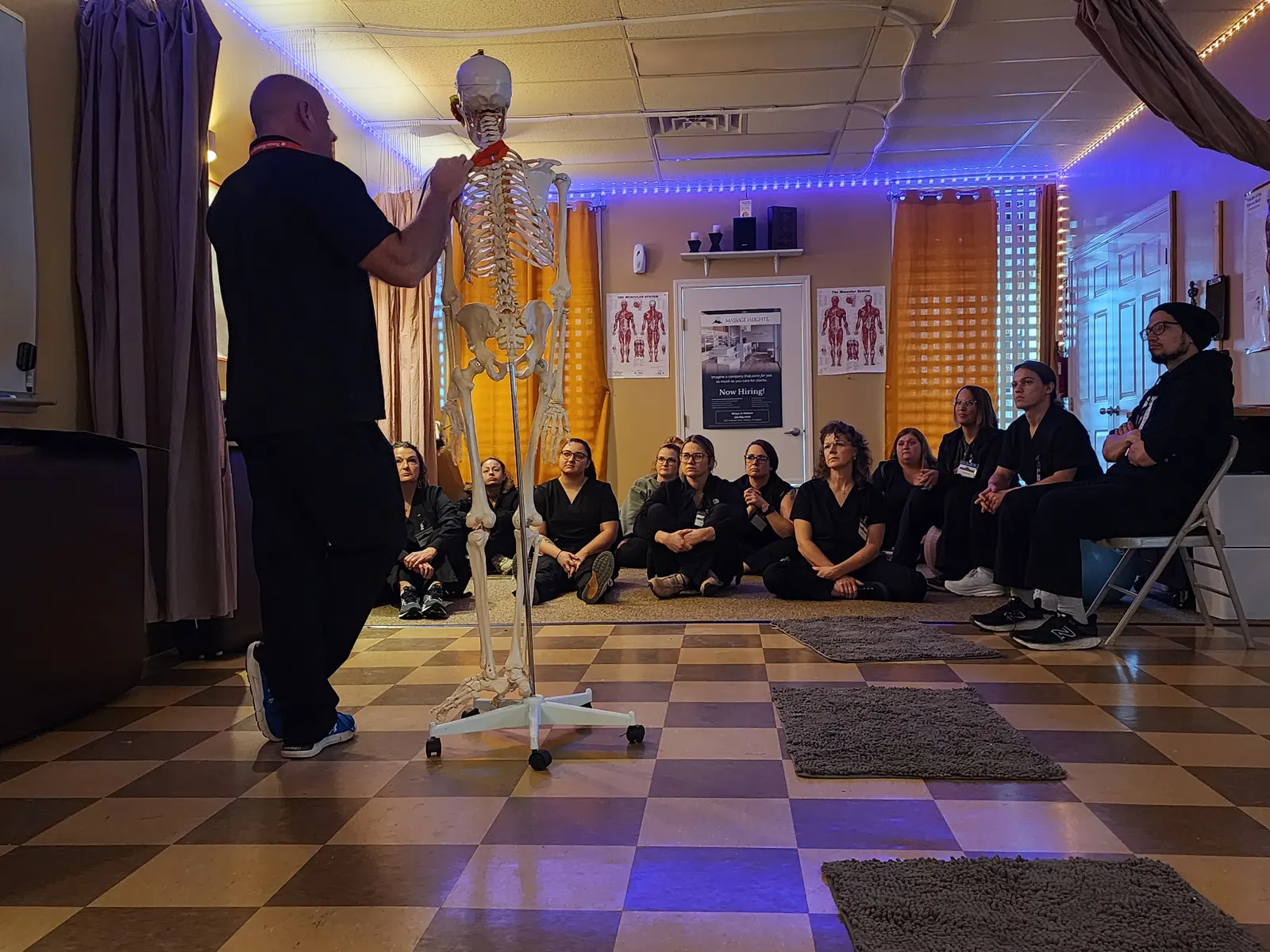 Instructor teaching skeleton anatomy to seated class — Texas Massage Academy, Brownwood TX