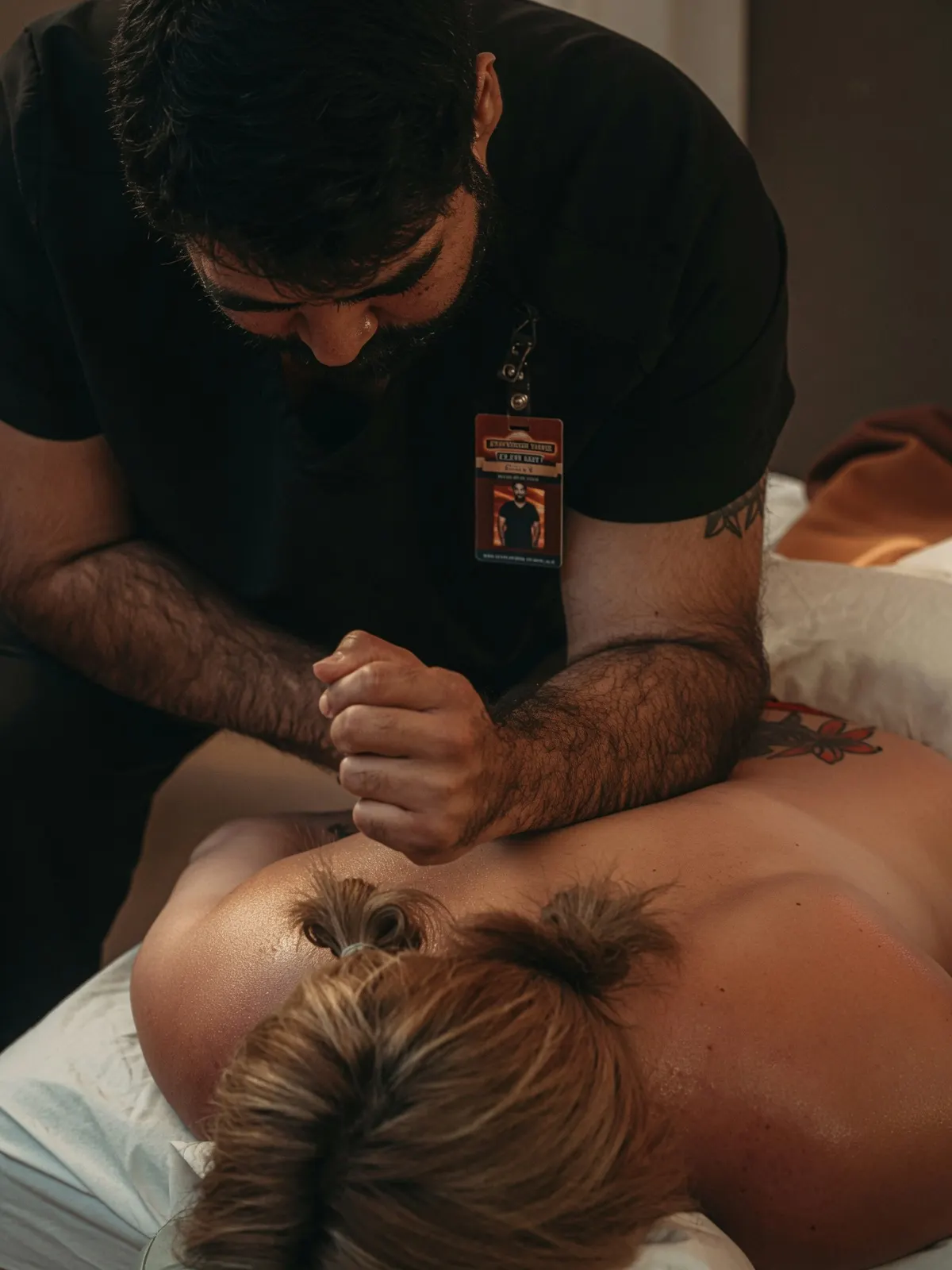 Bearded male student applying forearm deep tissue — Texas Massage Academy, Brownwood TX