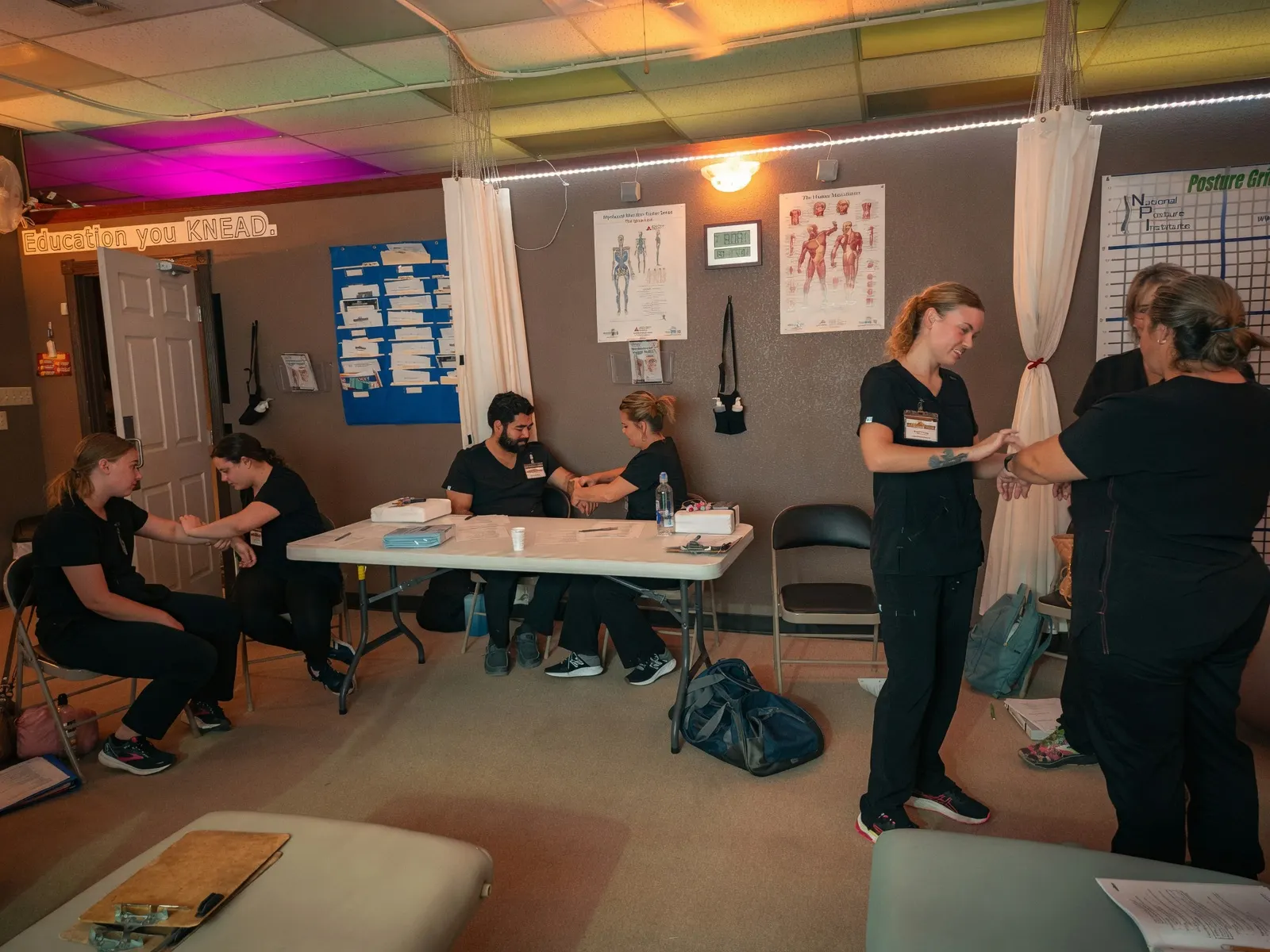 Classroom of students practicing techniques in pairs — Texas Massage Academy, Brownwood TX