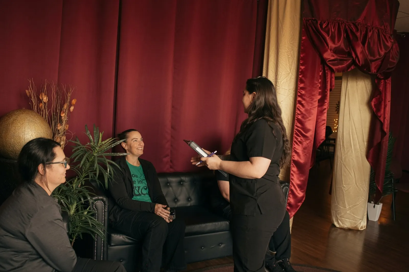 Student practicing a client intake interview in the lobby — Texas Massage Academy, Brownwood TX