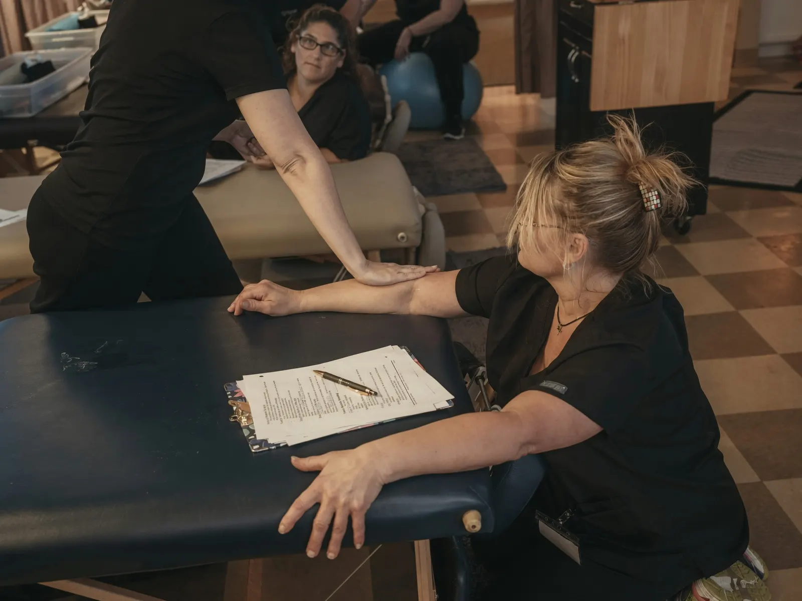 Students practicing arm techniques in massage class — Texas Massage Academy, Brownwood TX