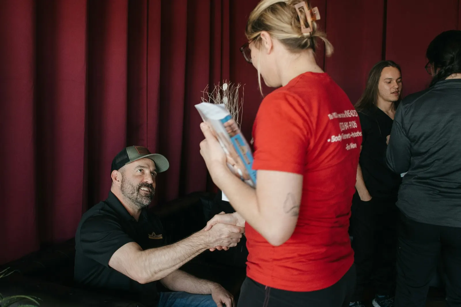 New massage student welcomed with a handshake at orientation — Texas Massage Academy, Brownwood TX