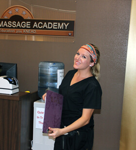 Massage Academy studnet having a blast in clinical Student smiling at camera in massage school in Brownwood and Abilene Texas during her clinical.